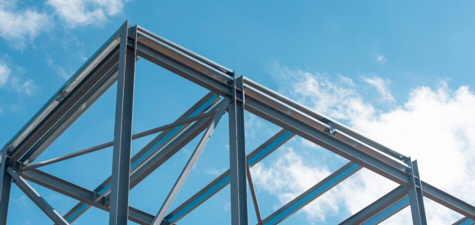 Steel,frame,construction,under,blue,sky